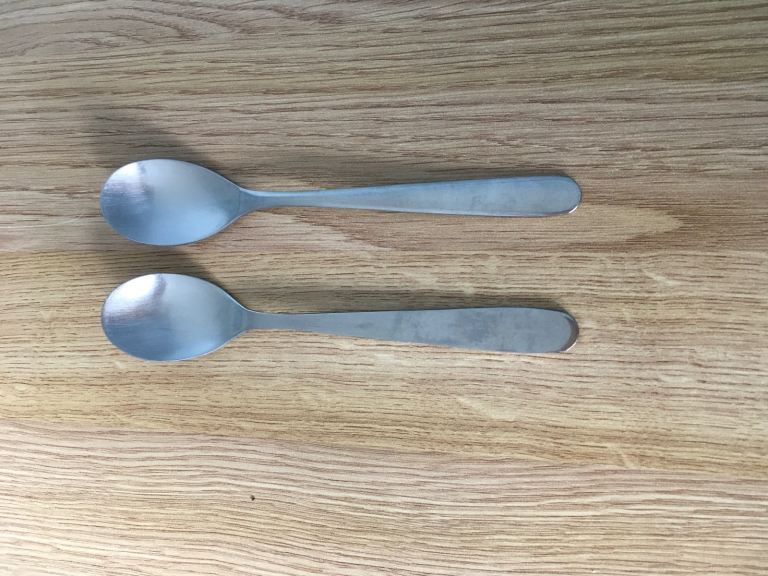 Two vintage British Airways stainless steel teaspoons