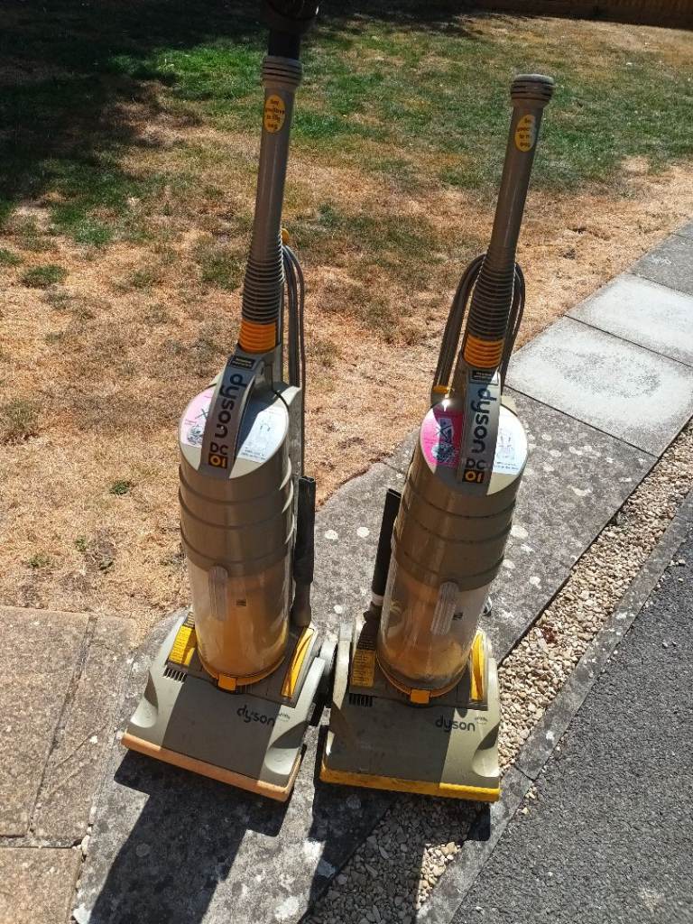Two Dyson DC01  Vacuum Cleaners - Yellow/Grey, Fair Condition
