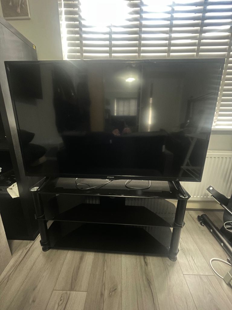 50” Polaroid tv and black glass stand