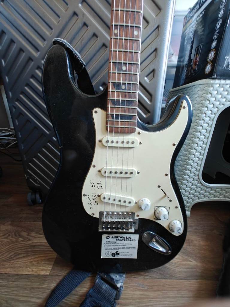 Fender alternative electric guitar with amp