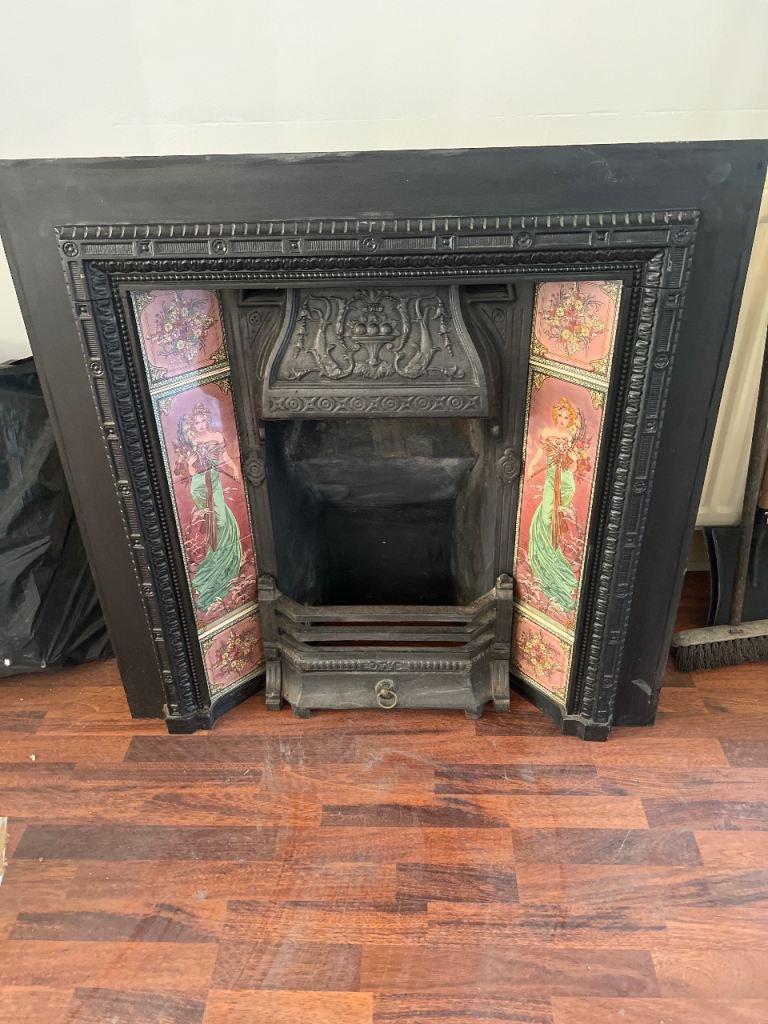 Cast Iron Fireplace with Decorative Tiles – Good Condition