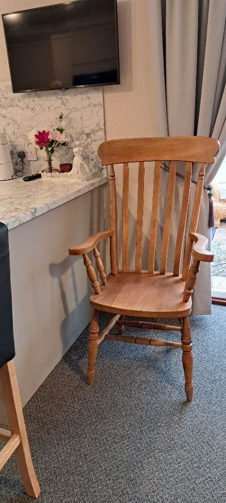 SOLID WOOD ARMCHAIR. HIGH BACK. IN GREAT CONDITION.NOW REDUCED PRICE.ONLY £40