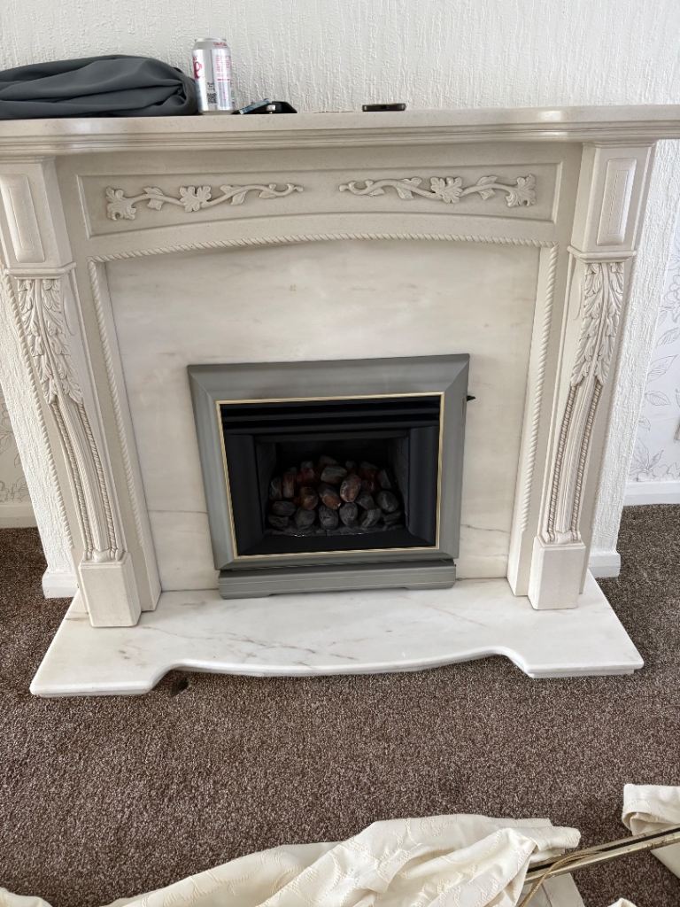 Gas fire with marvel surround and hearth 