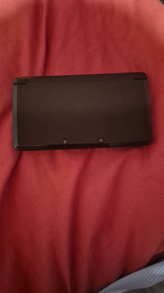 Old cosmos black 3ds console and pokemon omega ruby game with case