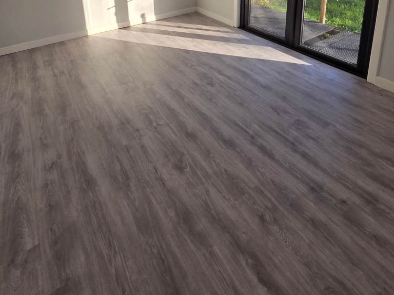 Modern grey laminate click lock flooring with foam underlay for sale - £50