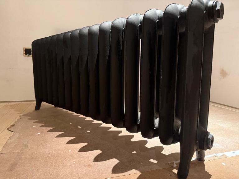 Brand new cast iron radiator in matt black