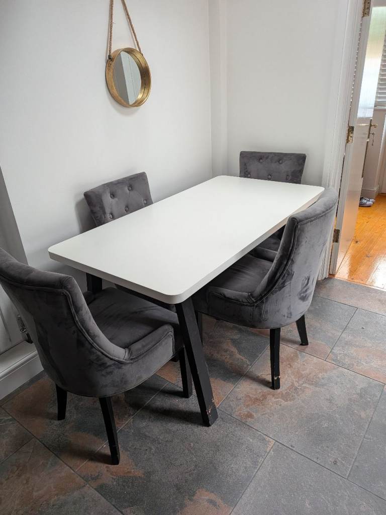 White Dining Table with Black Legs and 4 Grey Velvet Chairs