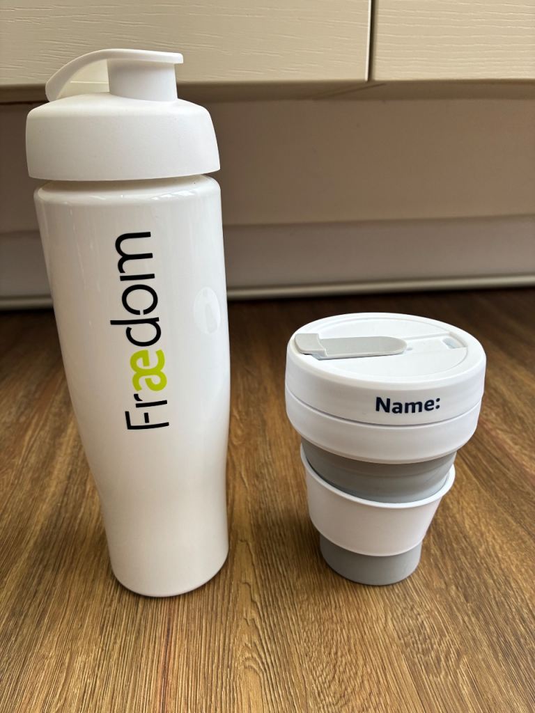 700ml white acrylic plastic water bottle and 350ml collapsible coffee cup. Both BPA free.