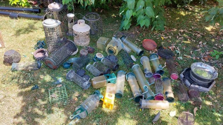 Collection of about 30 squirrel-damaged bird feeders