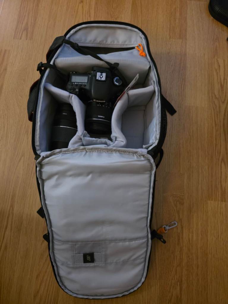 2 canon cameras with loads of accessories.