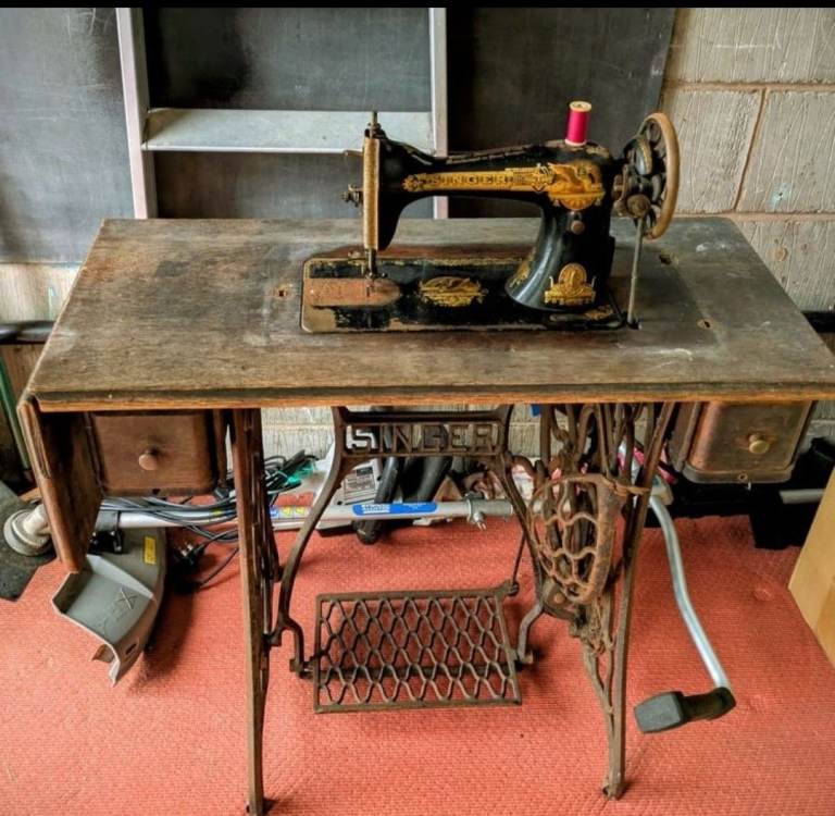 Antique singer sewing machine and pedal table