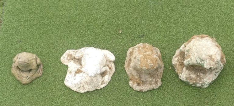 Group of 4 weathered stone garden ornaments in the form of frogs