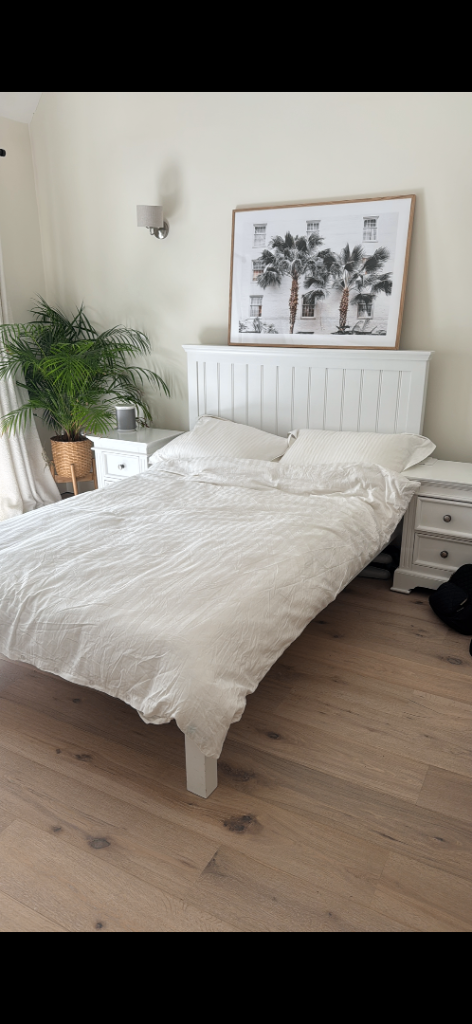 White wooden bed frame 
