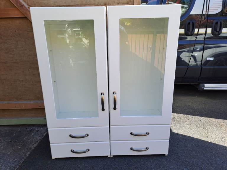 Pair of White free standing kitchen cabinets with Glass Doors and Drawers 