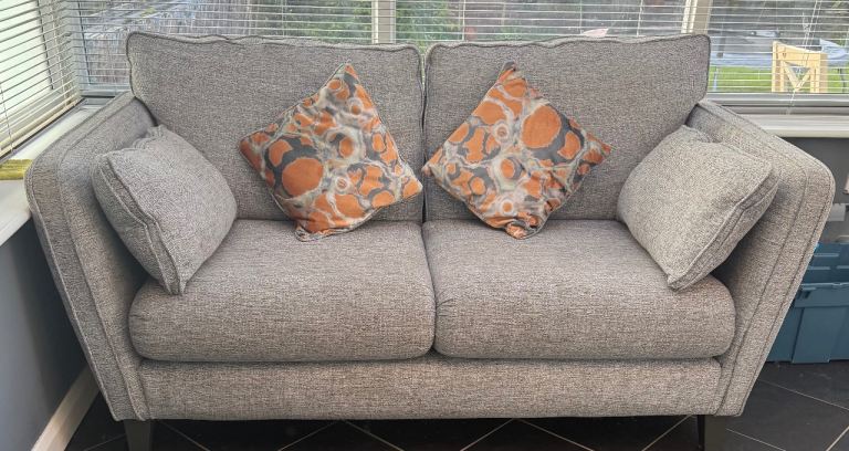 Grey two seater and Cuddle Chair “Next”