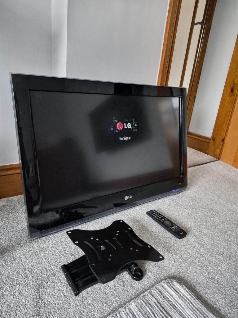 LG TV with TV bracket and remote control 