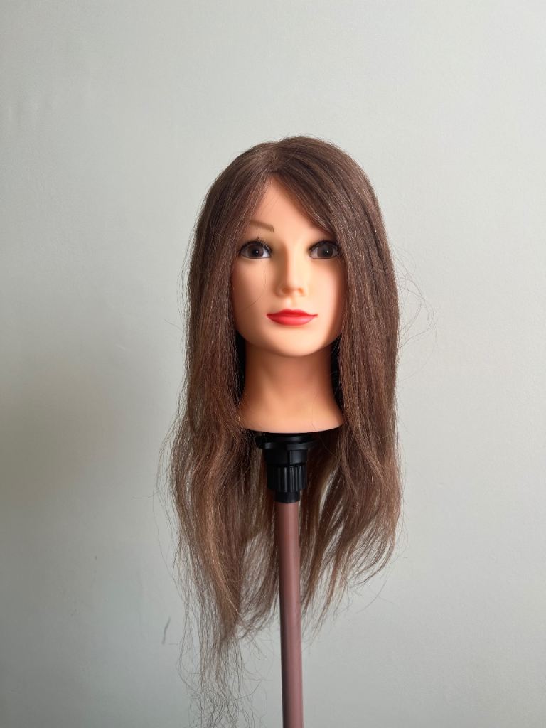 Human hair training head for hairdressers 