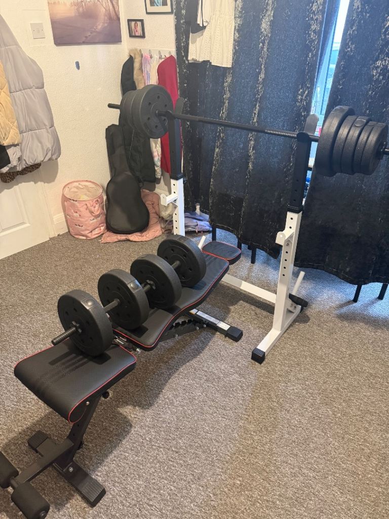 Weight bench with barbell/squat rack and 50kg weights with dumbells and barbell