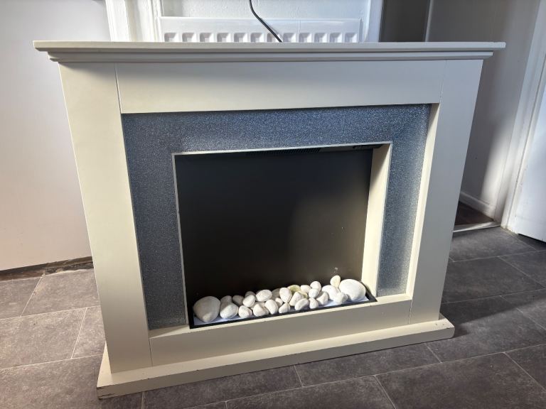 Modern Electric Fireplace with White Surround and Pebbles