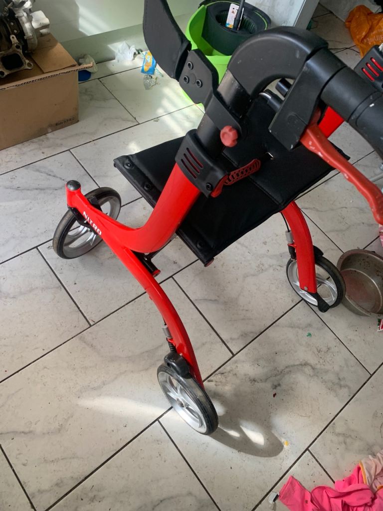 4 wheel Drive Walking aid with seat and basket for storage 