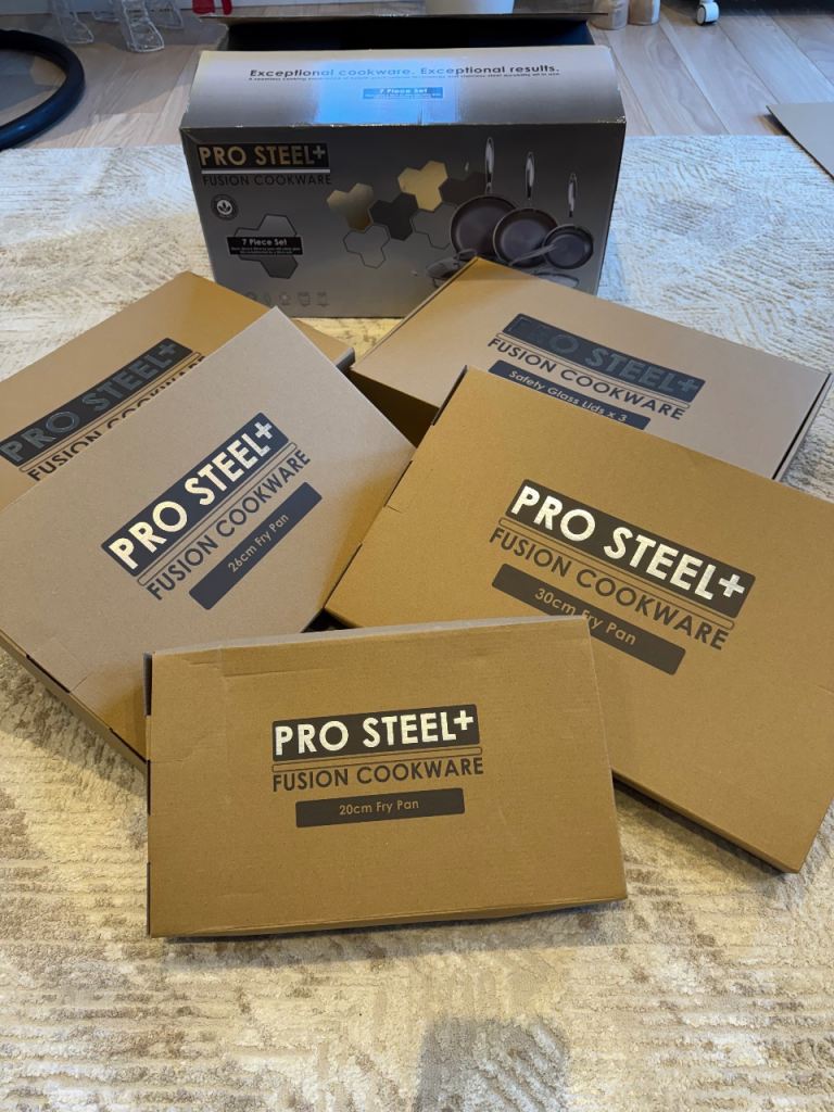 PRO STEEL Fusion 7 Piece Cookware Set 3 frying pans with lids plus wok. 