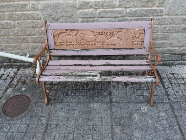 Childs bench project cast iron ends and cast iron backrest with farm animals wood needs replacing