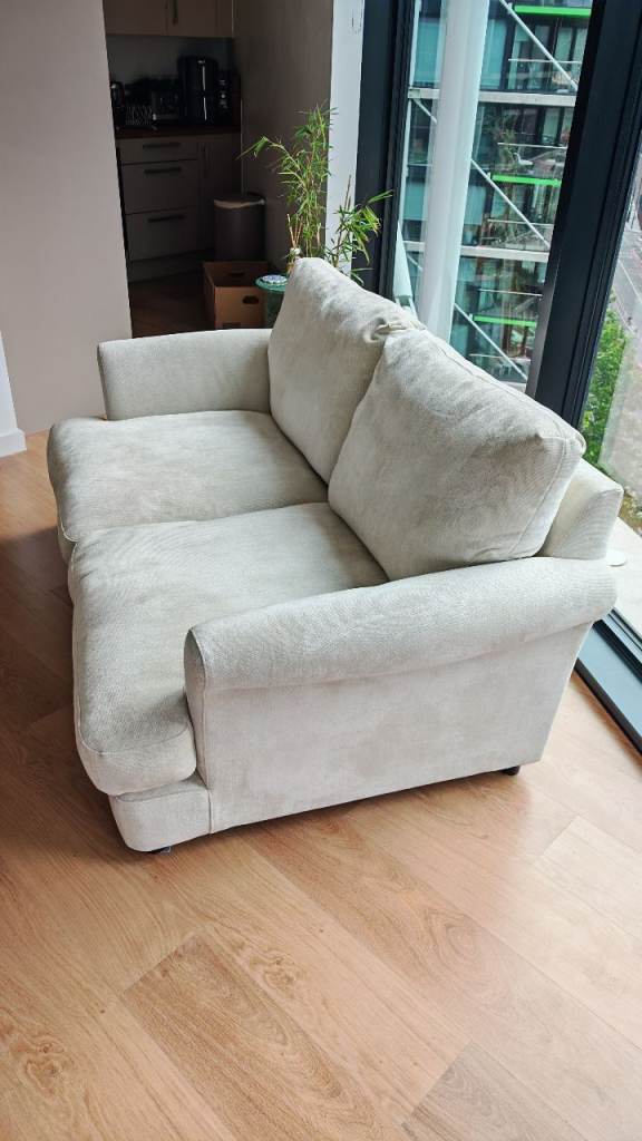 Cream Fabric Two-Seater Sofa – Good Condition