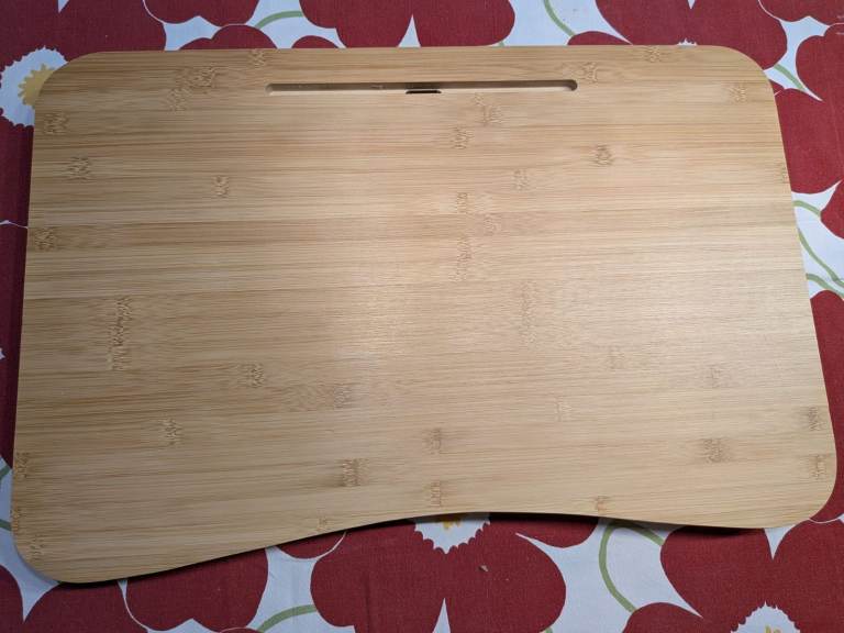 Bamboo bed table, with metal foldable legs.