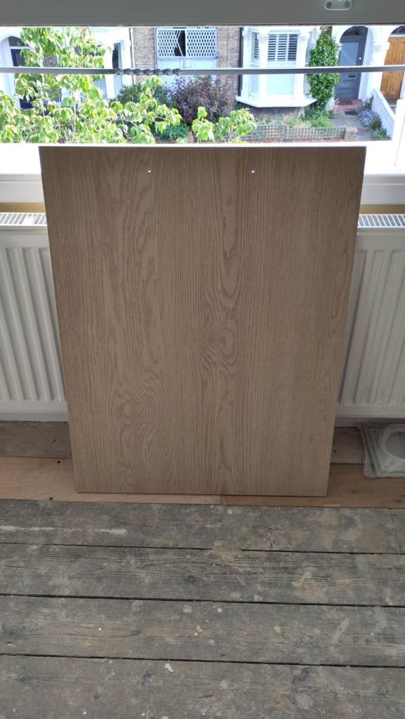 Kitchen cabinet door - wood effect - 59.5cm wide x 79cm tall - previously used for washing machine