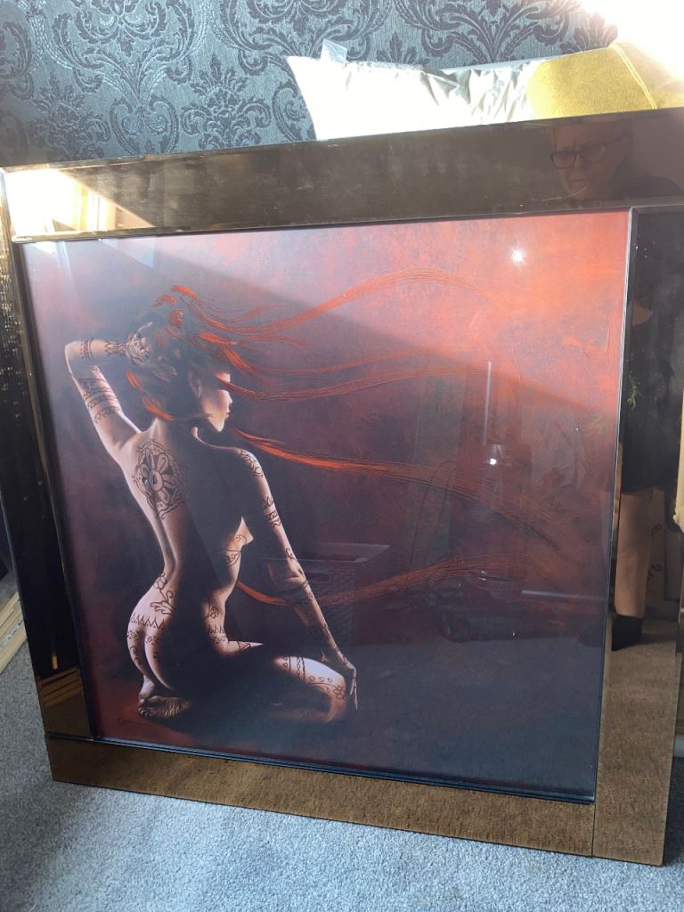 Very stylish prints and mirror to match with bronze mirror surround