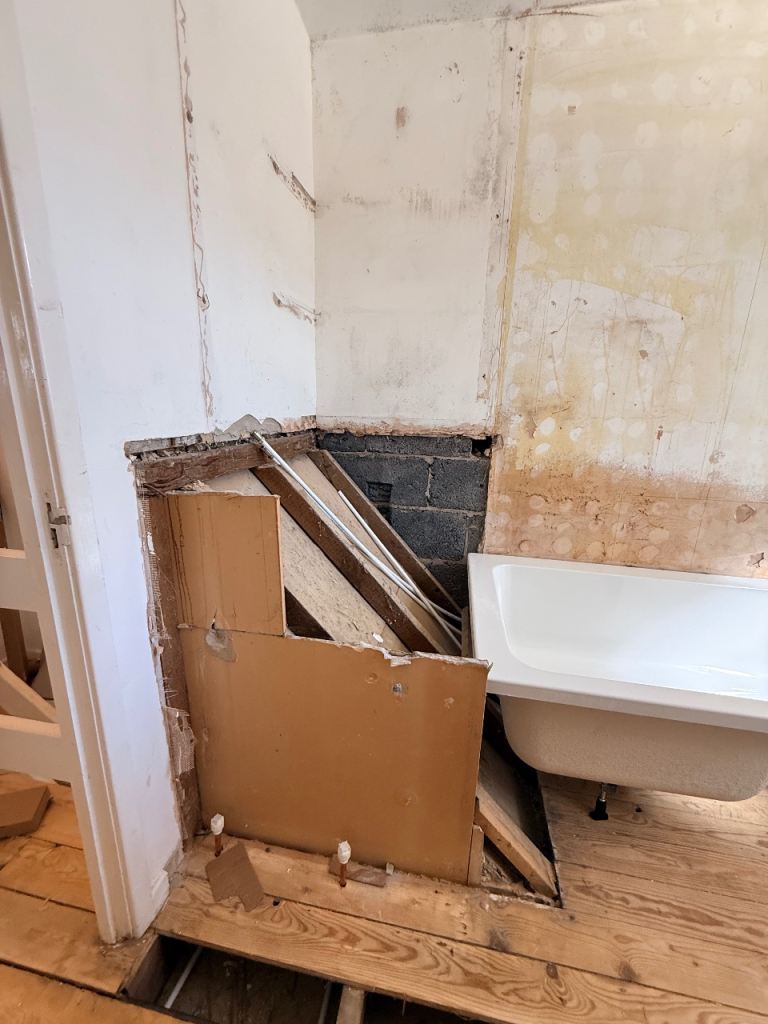 Small unit building in bathroom and under stairs 