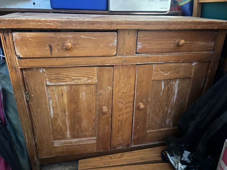 Wooden cabinet with shelves on top