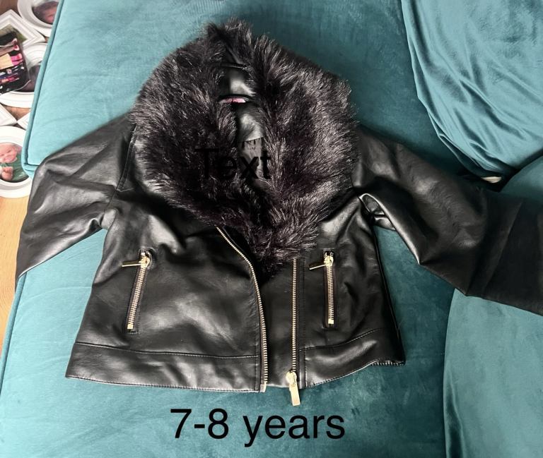 New 7-8 years black fake leather jacket. Detachable fur collar 