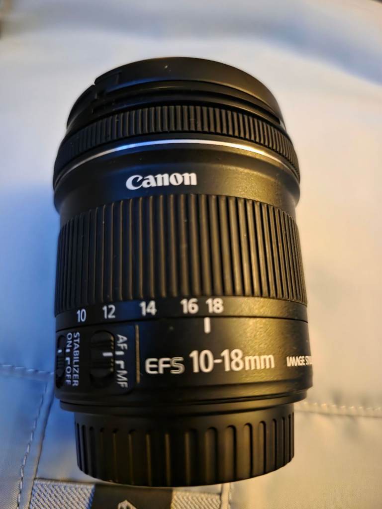 2 canon cameras with loads of accessories.