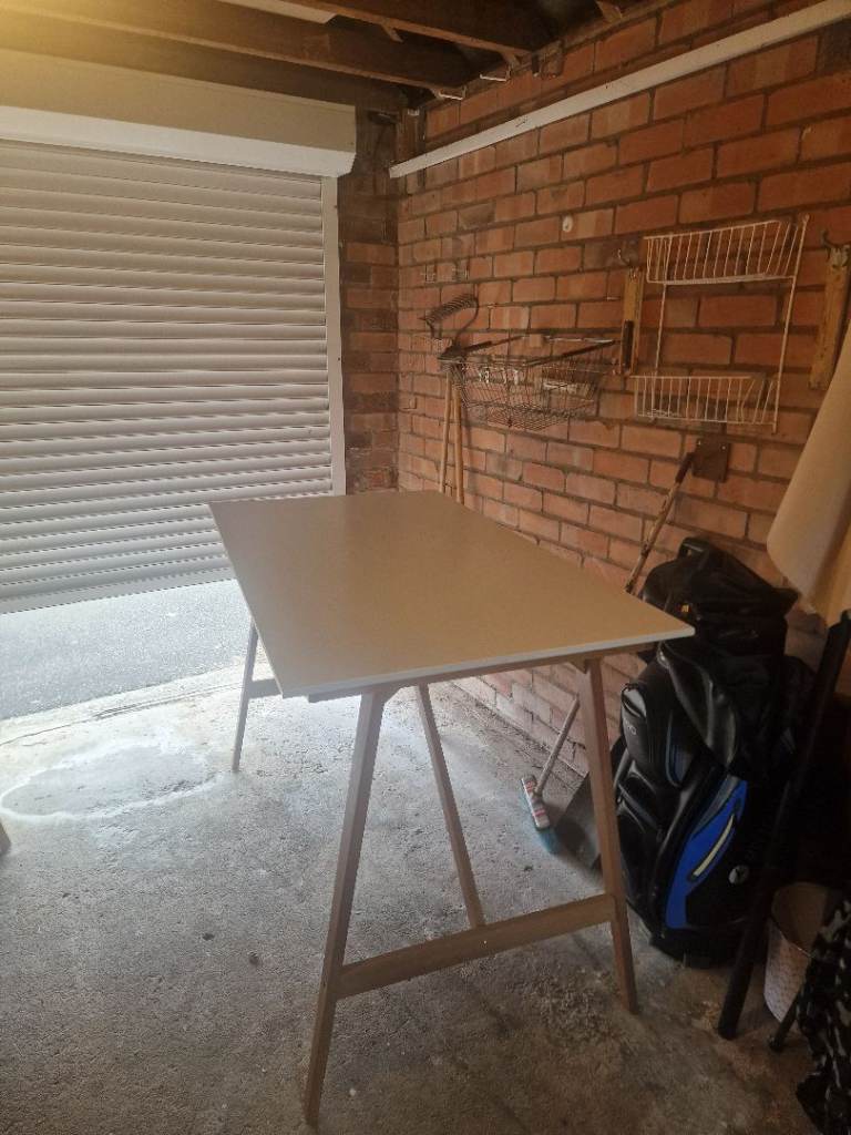 White and wooden raised desk
