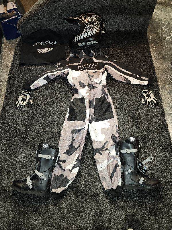 Wulf dirt bike outfit with helmet gloves and boots