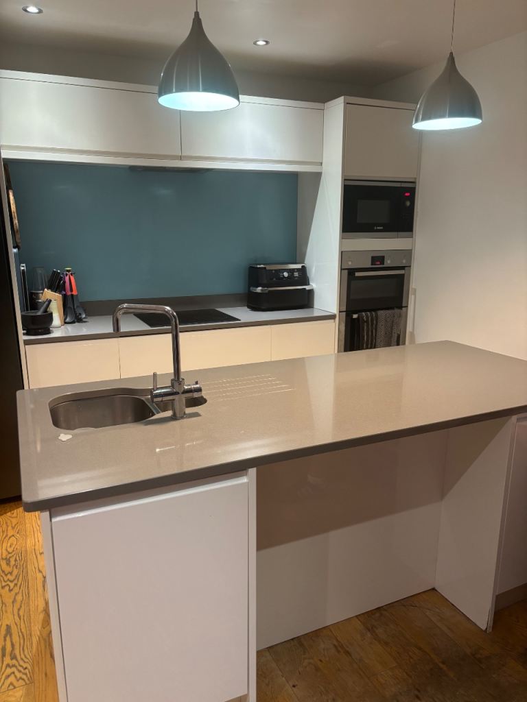 Modern Kitchen, quartz worktops, Island Unit with Sink and Hob Cutout and double oven and microwave.