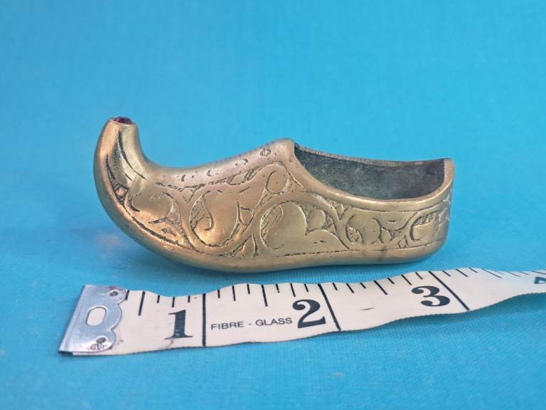 Vintage Indian etched brass shoe-shaped ashtray.