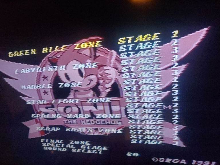 Sega Mega Drive 2 console with 2 controllers and 7 games.