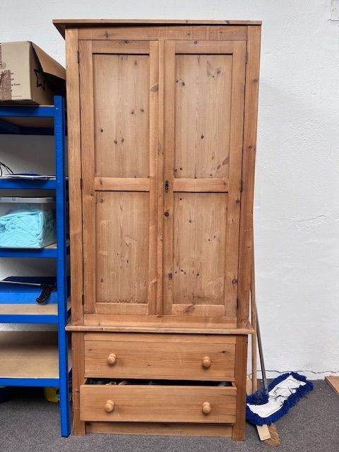 Wooden wardrobe with hanging space and drawers