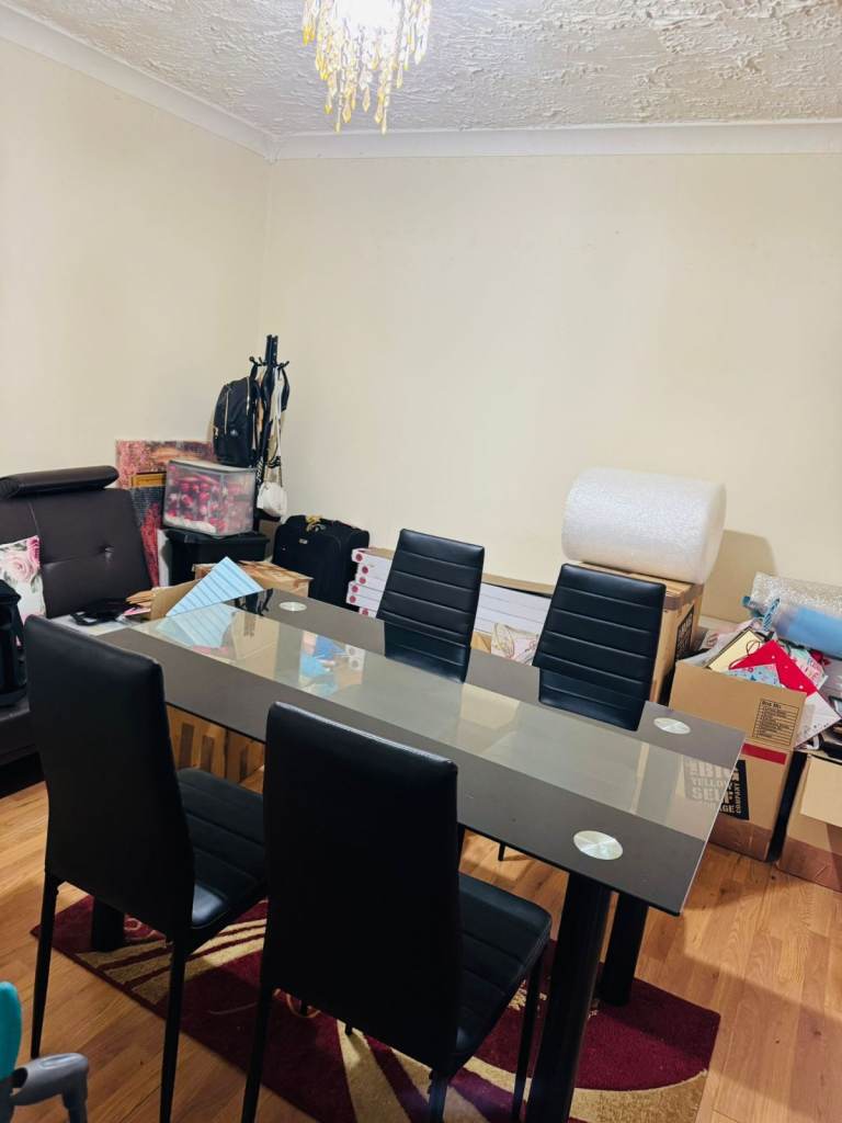 Glass Dining Table and 6 Black Chairs – 