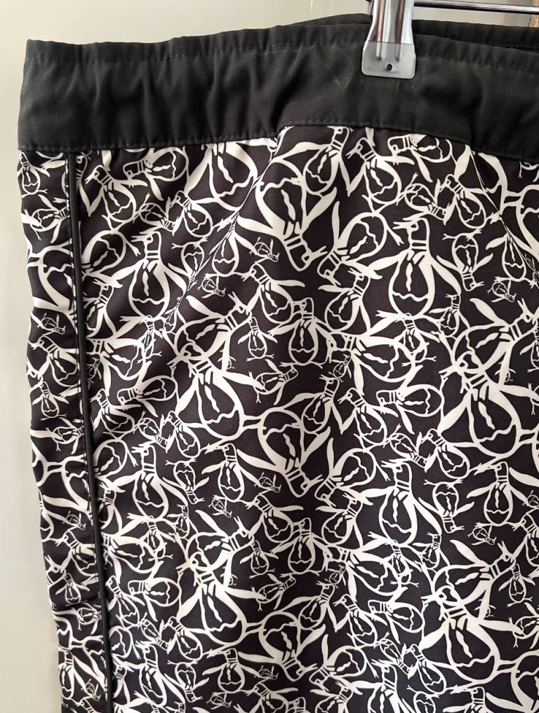 Cooling looking men’s board swim holiday shorts featuring branded Penguins logo