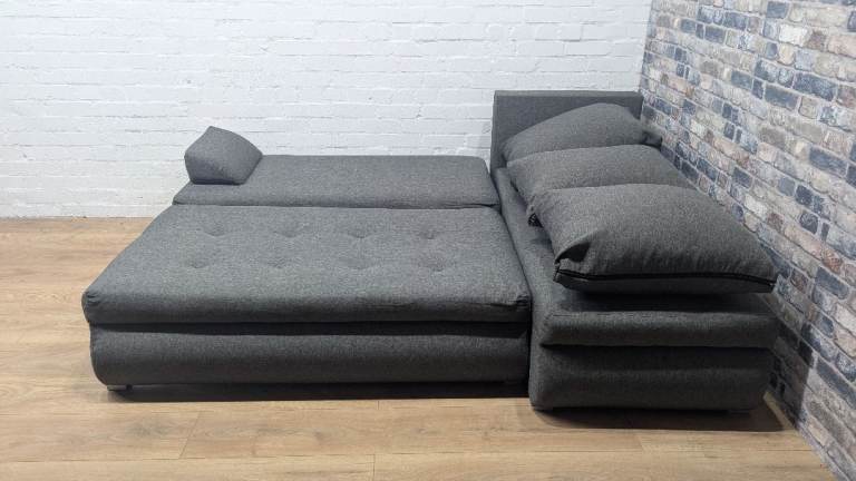 Grey corner sofa bed with storage
