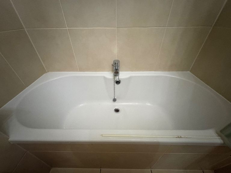 White Bathroom Suite - Bathtub, Sink, and Toilet
