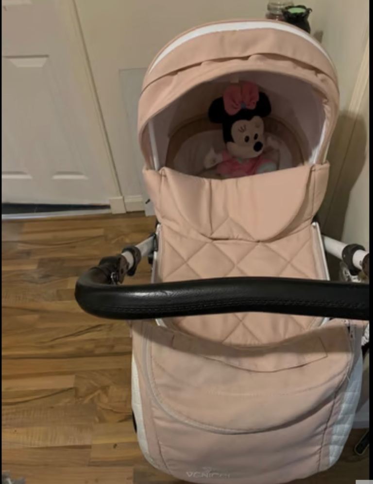 Pink and white venicci pram travel system