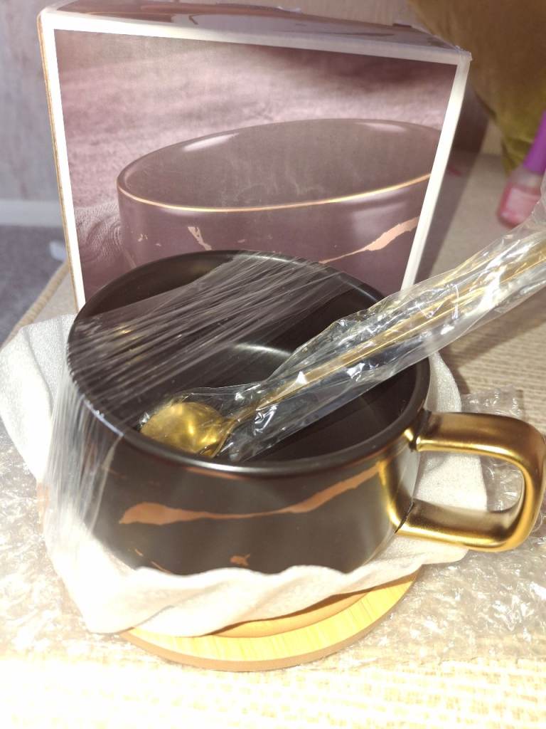 Black and gold Cup and coaster
