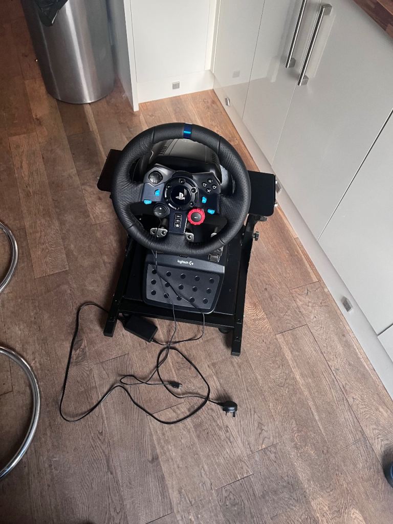 Logitech G29 Racing Wheel + Pedals + Adjustable Racing Stand (PS5/PS4/PC)