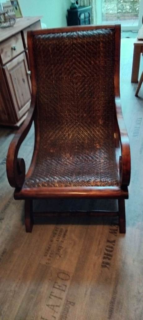 Large, oak stained, wood and wicker chair