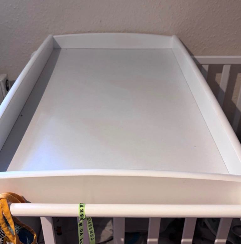 On top of the crib baby changer