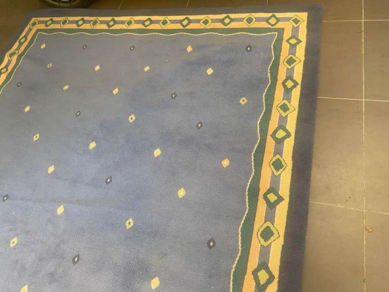 Blue and yellow wool rug 250cm by 330cm 